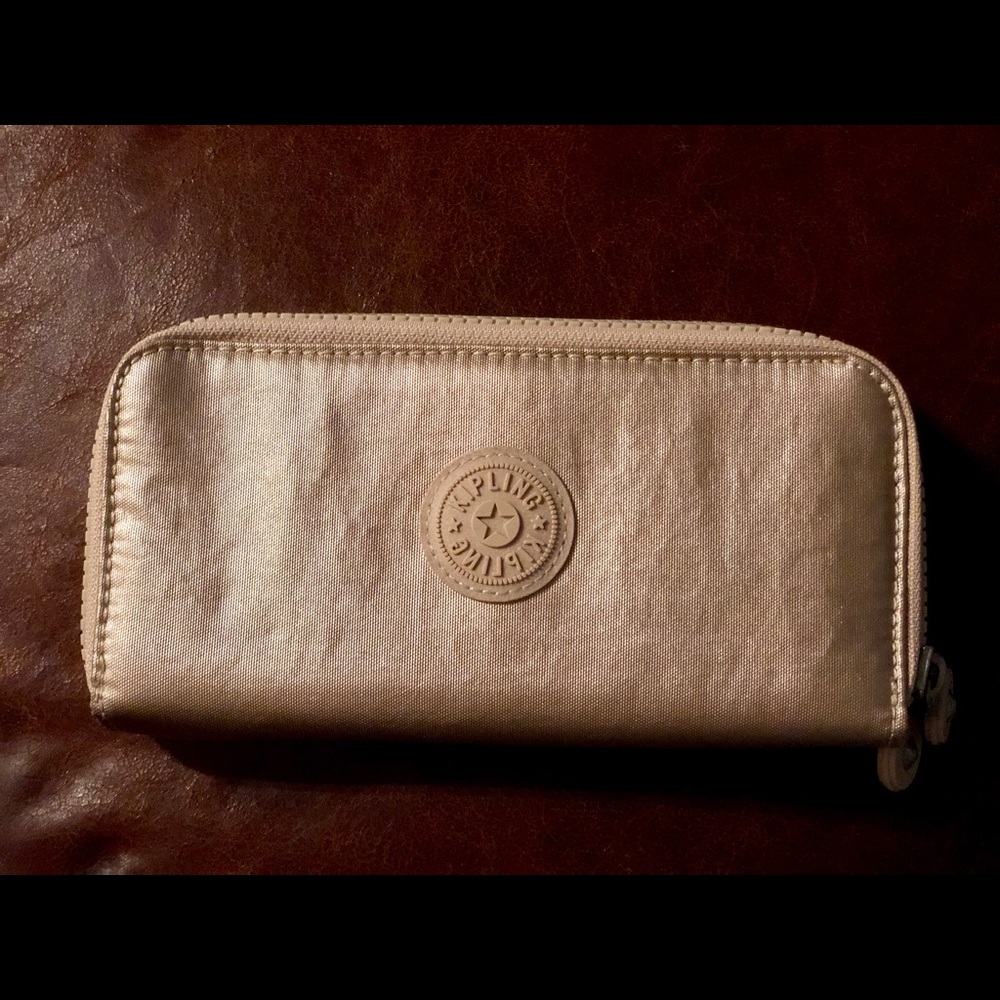 Kipling Uzario Wallet in Sparkly Gold like new